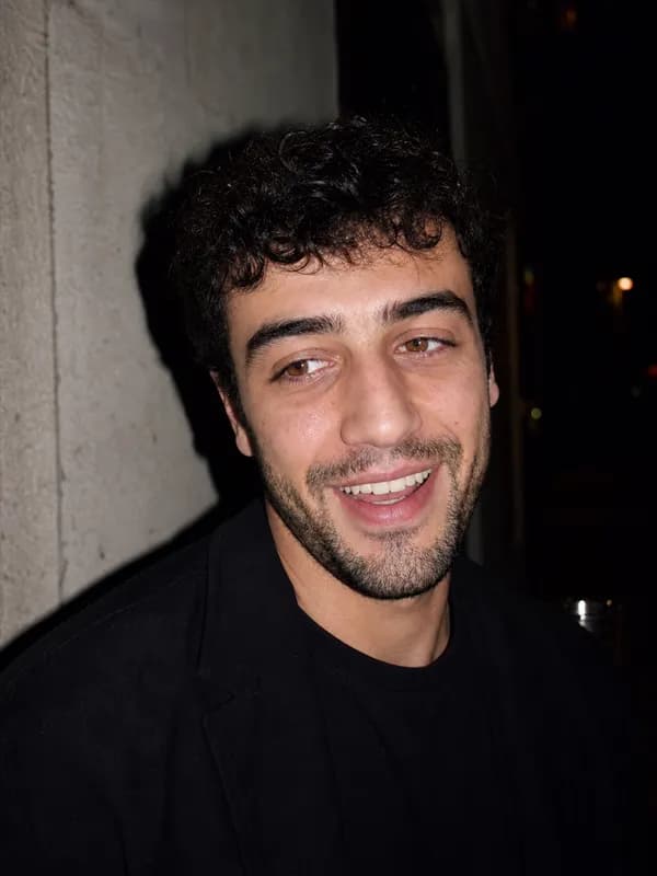 Demo profile finisher: on-camera flash smile at night